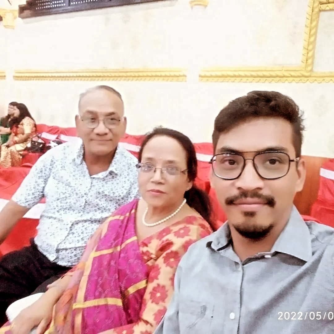 Milan sharing a photo with family at a gathering