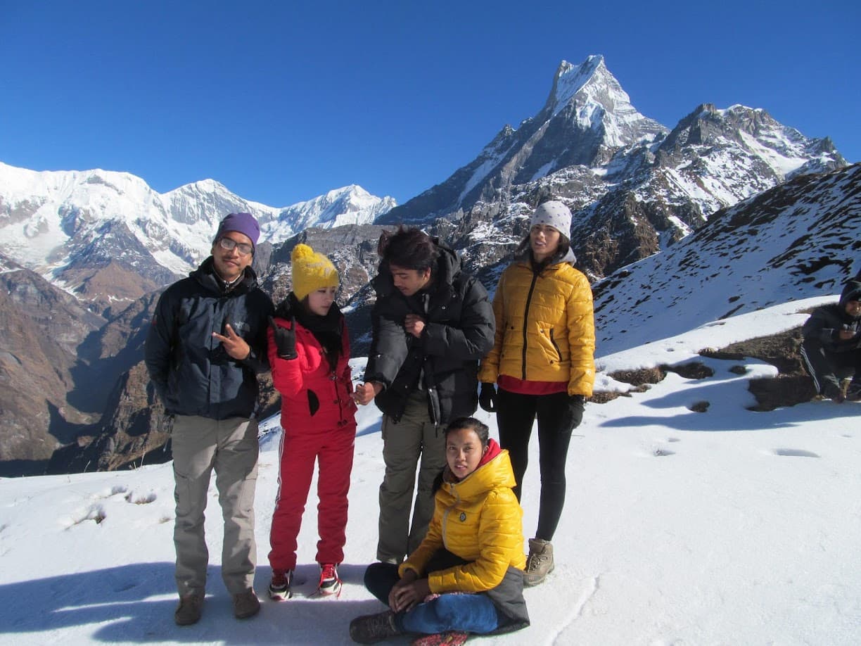 Milan and fellow travellers on a snow-covered mountain trek